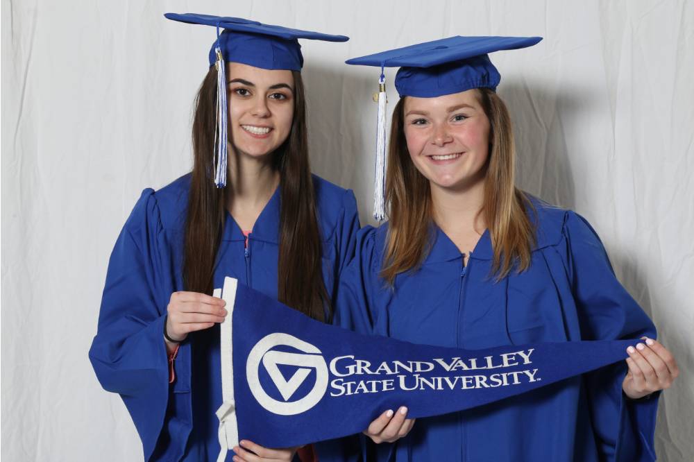 two girls in cap and gown